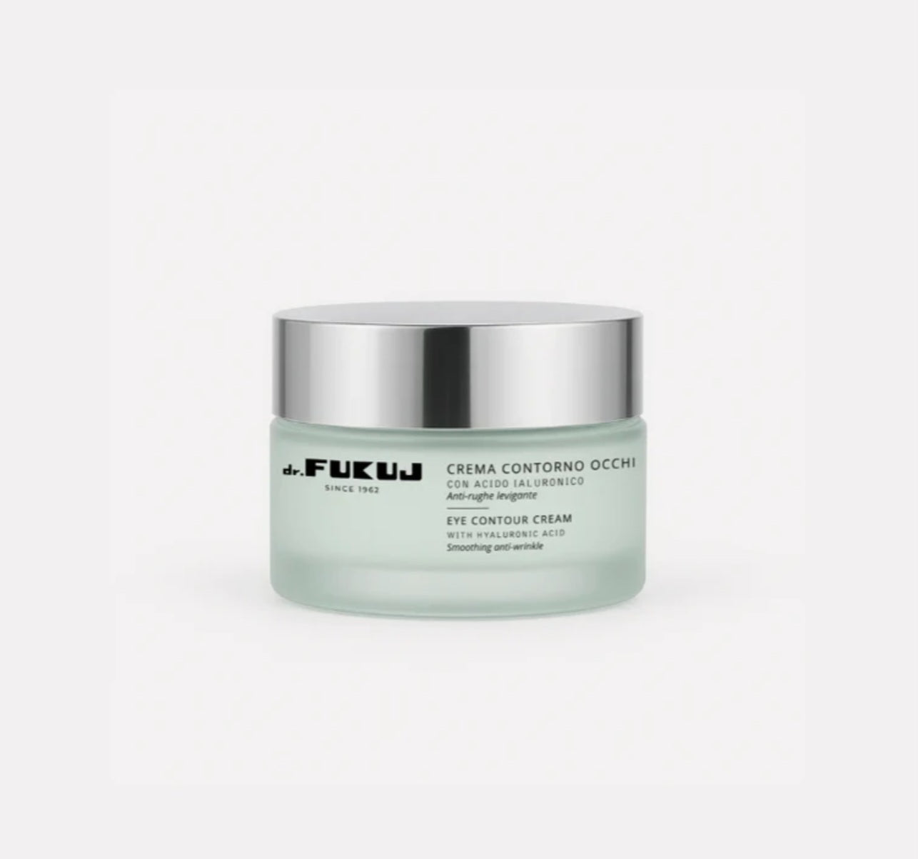 Jar of eye contour cream with silver lid on a white background